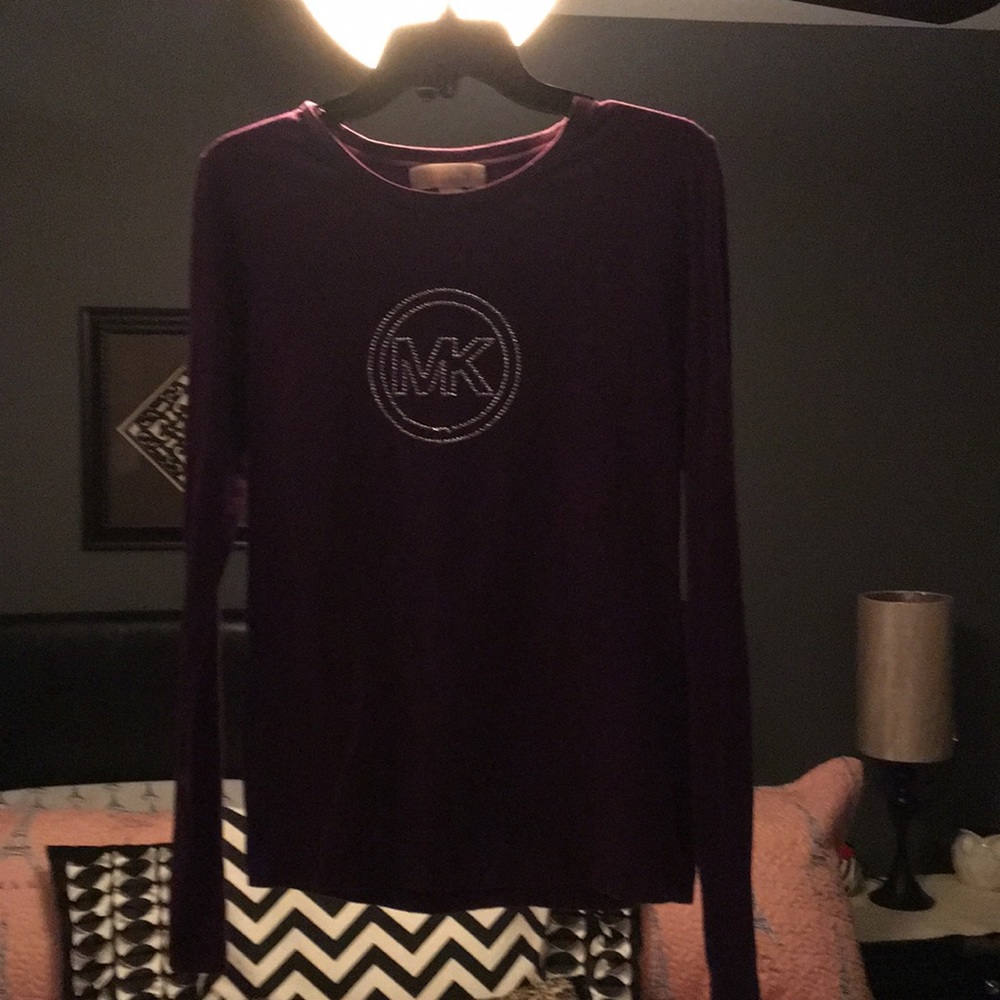 MK size L. Used/good shape. Small hole.